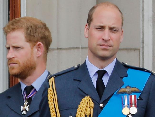 (FILES) In this file photo taken on July 10, 2018 Britain's Prince Harry, Duke of Sussex, (L) and Britain's Prince William, Duke of Cambridge (R) stand on the balcony of Buckingham Palace on July 10, 2018 to watch a military fly-past to mark the centenary of the Royal Air Force (RAF). - Princes William and Harry on January 13, 2020 put on a rare joint front to dismiss a "false story" speculating about their relationship, as senior royals met for talks about the younger brother's future. "For brothers who care so deeply about the issues surrounding mental health, the use of inflammatory language in this way is offensive and potentially harmful," they said. (Photo by Tolga AKMEN / AFP)