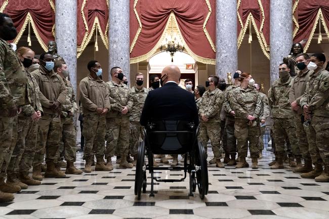 WASHINGTON, DC - JANUARY 13: Rep. Brian Mast (R-FL) (C) gives members of the National Guard a tour of the U.S. Capitol on January 13, 2021 in Washington, DC. The House of Representatives is expected to vote to impeach President Donald Trump later today, after Vice President Mike Pence declined to use the 25th amendment to remove him from office after protestors breached the U.S. Capitol last week. Stefani Reynolds/Getty Images/AFP == FOR NEWSPAPERS, INTERNET, TELCOS &amp; TELEVISION USE ONLY ==