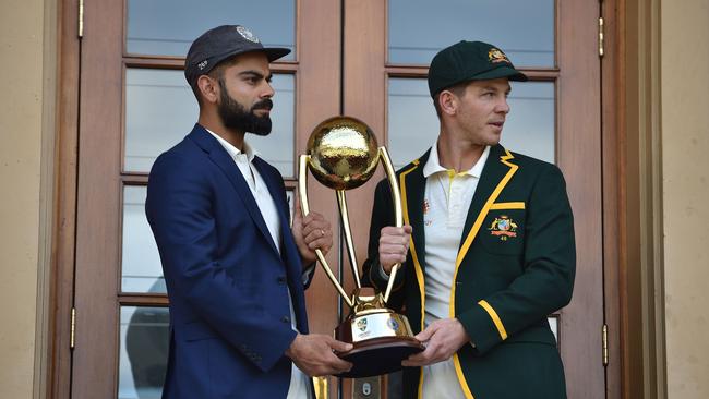 Australia cricket captain Tim Paine (right) and India cricket captain Virat Kohli pose with the Border Gavaskar trophy ahead of the first Test at the Adelaide Oval. Picture: AFP