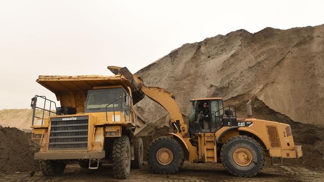 Tractors work at the Metlaoui phosphate production plant on March 8, 2018, in the Metlaoui mining region, one of the main mining sites in central Tunisia... / AFP PHOTO / FETHI BELAID