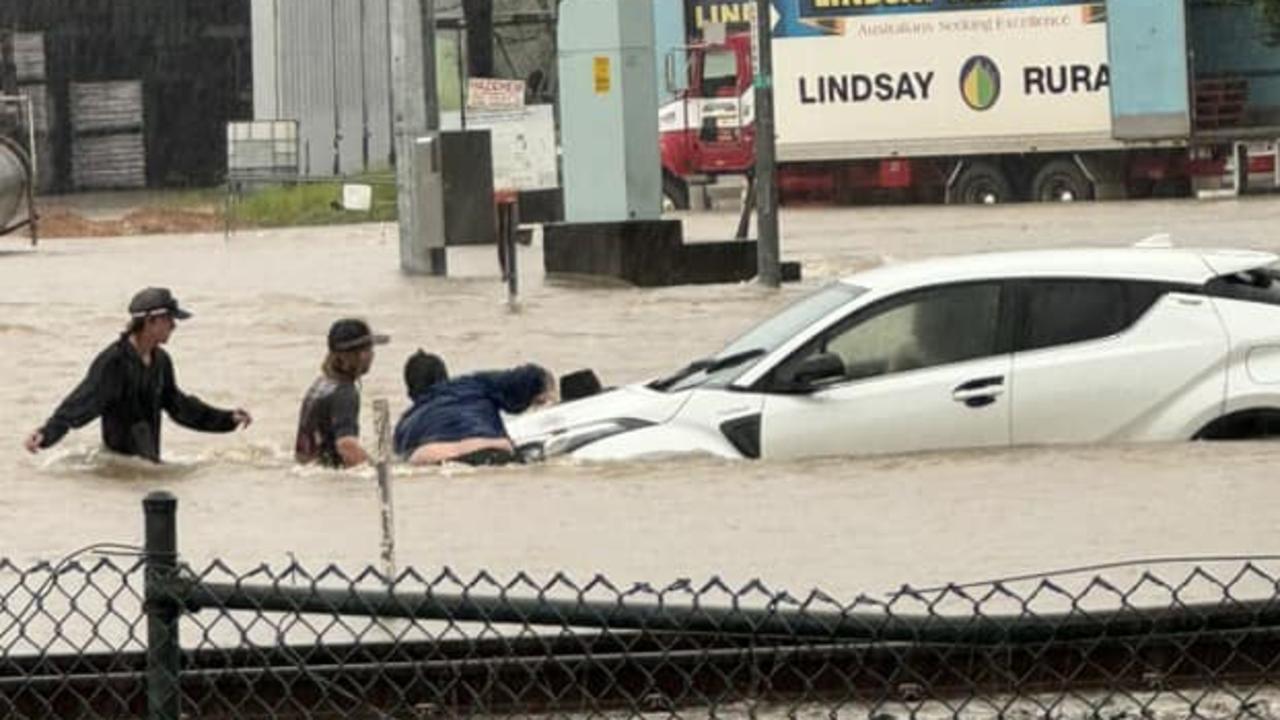 Bruce Highway flooded after more than 200mm of rain in half a day The