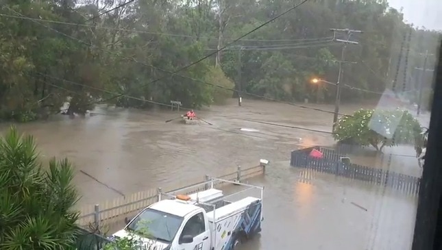 Man rowing a boat down Gold Coast street. Footage courtesy of Kelly Glover