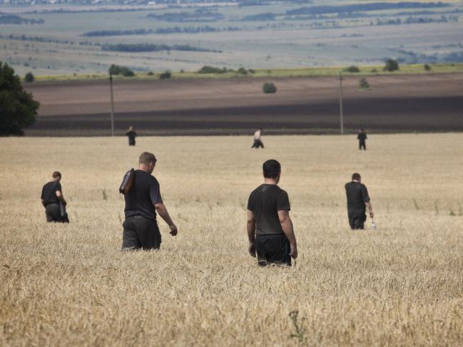 Off-duty coal miners helped to comb the crash site of the Malaysia Airlines plane. Picture: Ella Pellegrini