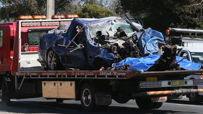 The car involved in a fatal crash at Hillier on Saturday is towed from the scene. The ute hit a tree, killing the 24-year-old male driver. Picture: Emma Brasier