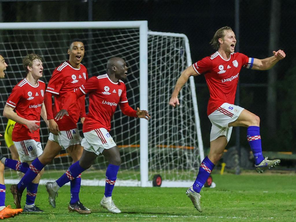 Austin Ludwik celebrates for Gold Coast Knights with his teammates in tow. Picture: Gold Coast Knights