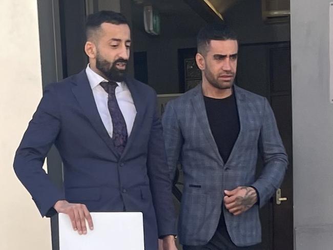 Abufazi (also known as Abolfazi) Hosseini, right, leaving Wyong Local Court with his lawyer (left), after being convicted of stalking his girlfriend by putting an AirTag in the boot of her car. Picture: NewsLocal.