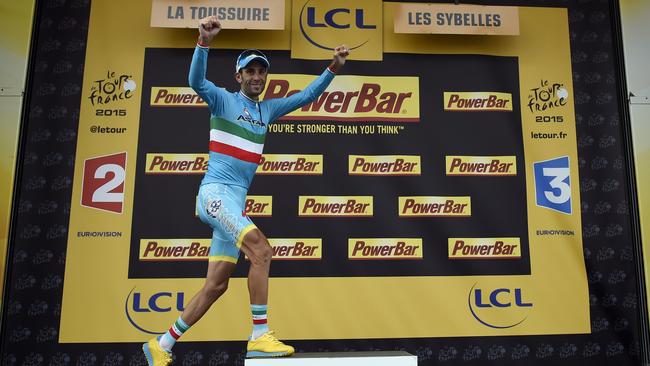 Stage winner Italy's Vincenzo Nibali celebrates on the podium after winning the 138km nineteenth stage.