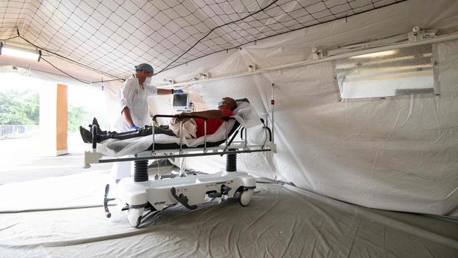 A Covid-19 patient is monitored in a triage tent at the Pierre Zobda-Quitman University hospital on the Caribbean island of Martinique. Picture: Alain Jocard/AFP