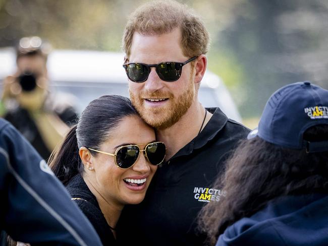 Duke and Duchess of Sussex, Prince Harry (R) and his wife, Meghan Markle embrace at The Invictus Games in The Hague on April 16, 2022. Picture: Remko de Waal (ANP, AFP, Netherlands OUT)