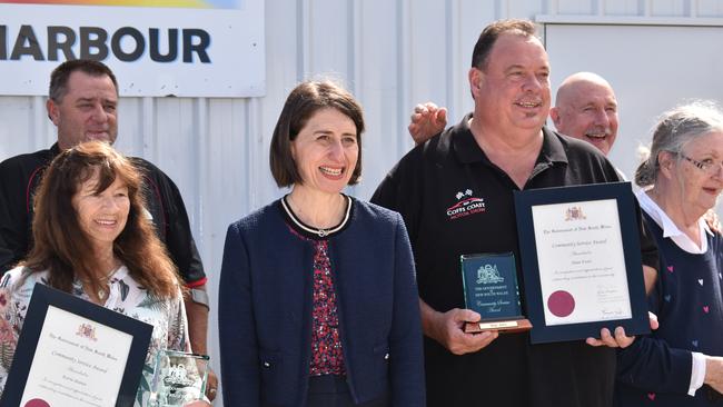 NSW Premier Gladys Berejiklian presented locals Dean Evers and Aunty Kerrie Burnet with Community Service Awards in Coffs Harbour.