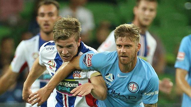 Riley McGree (left) of Newcastle Jets contests with Luke Brattan of Melbourne City during the A-League Round 18 match between Melbourne City FC and Newcastle Jets at AAMI Park, Melbourne, on Thursday, January 25, 2018. (AAP Image/Hamish Blair) NO ARCHIVING, EDITORIAL USE ONLY