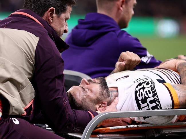 MELBOURNE, AUSTRALIA - MAY 11:  Adam Reynolds of the Broncos is taken off the field on a stretcher after a head knock during the round 11 NRL match between Melbourne Storm and Brisbane Broncos at AAMI Park on May 11, 2023 in Melbourne, Australia. (Photo by Robert Cianflone/Getty Images)