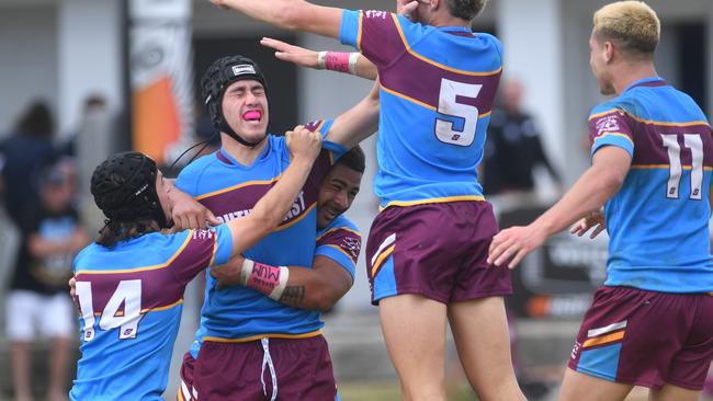 Ryder Williams (headgear, pink mouthguard) celebrates try. Picture: Evan Morgan