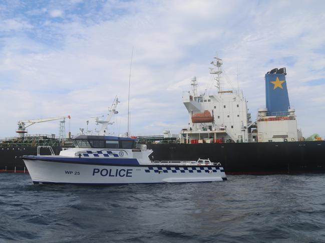 The NSW water police boat WP25 adjacent to oil tanker, Haruna Express where 21 crew were tested for COVID-19. Picture: Supplied / NSW Police