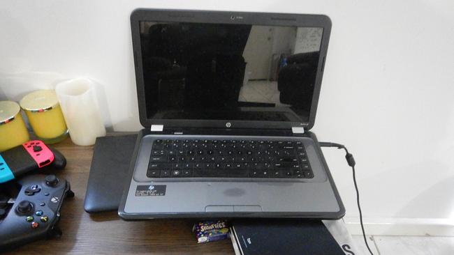 Police seized a laptop during the raid of a man's house. The man is accused of accessing child abuse material. Picture: AFP