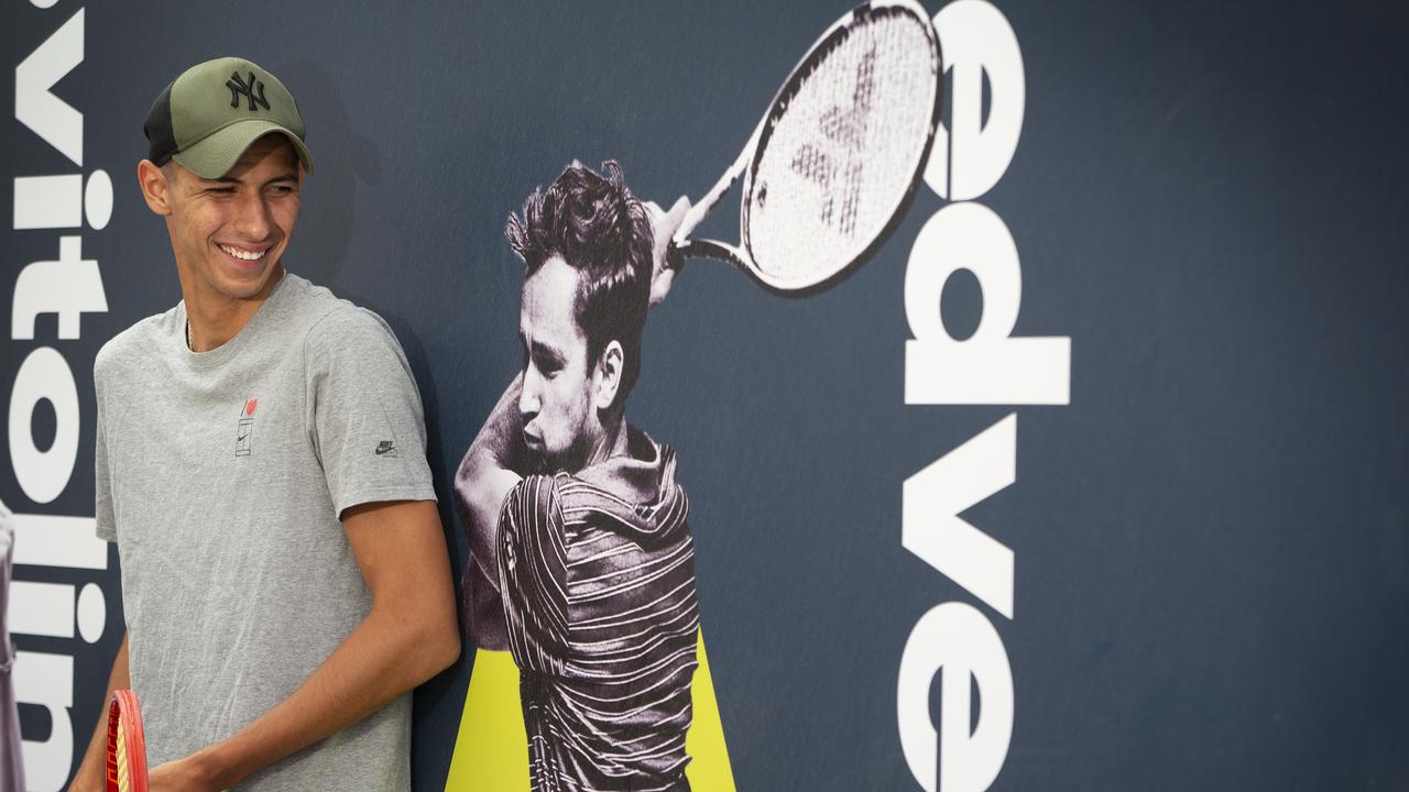 Alexei Popyrin posing for a photo at Melbourne Park.