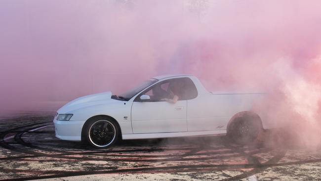 Regular burnout competition entrant Jai Goward, of Gladstone, performs a burnout in his Holden Commodore SS ute under controlled conditions. Mr Goward said he doesn't condone anyone doing burnouts on public roads. Picture: Rodney Stevens