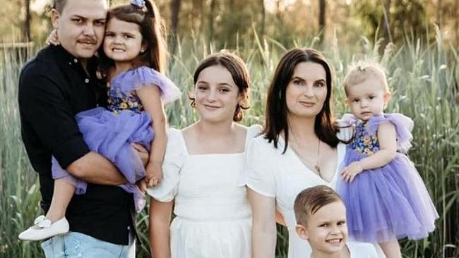 A family photo including Tahlia Brown (right) holding daughter Taidyn “Totty” Murphy. Totty drowned in a spa at the family's home at Gracemere in Central Queensland.