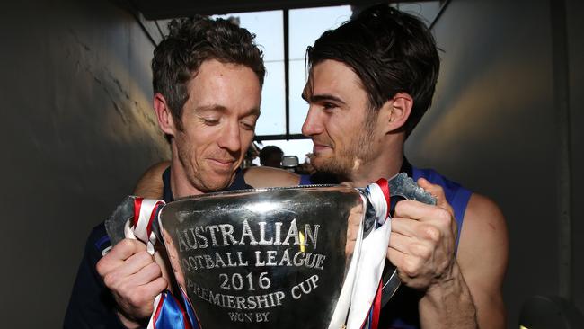 Western Bulldogs captain Bob Murphy and stand-in skipper Easton Wood with the 2016 premiership cup. Picture: Michel Klein