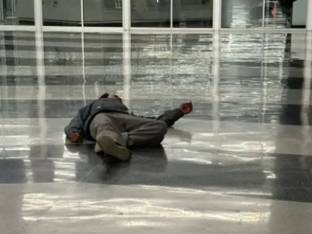 One Twitter user posted photographs of a homeless man sprawled on the floor in Terminal 2. Picture: Twitter/Natasha Patel