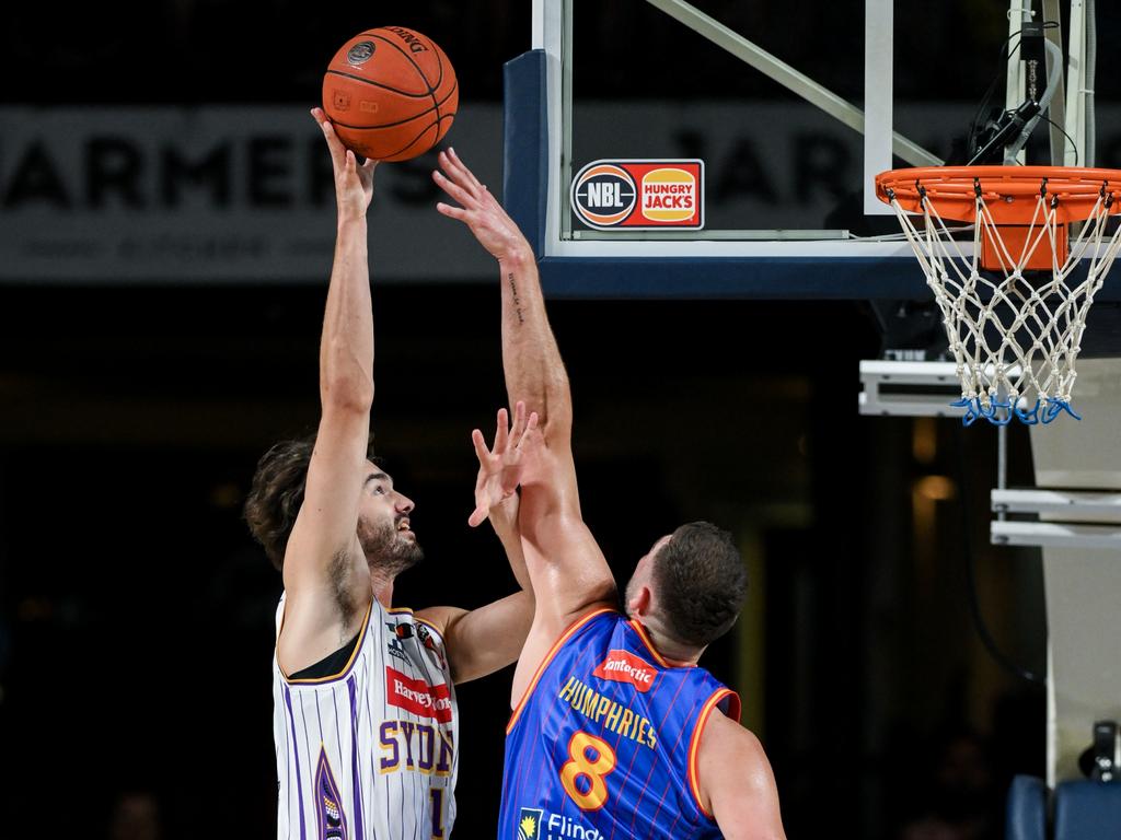 Kings big Jordan Hunter pictured shooting for two while defended by Adelaide’s Issac Humphries - the man who could replace him in Sydney for NBL25. Photo: Mark Brake/Getty Images.