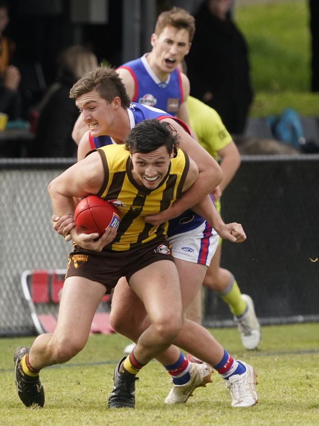 EFNL: Rowville’s Maverick Taylor can’t escape Robert Mallison of South Croydon. Picture: Valeriu Campan