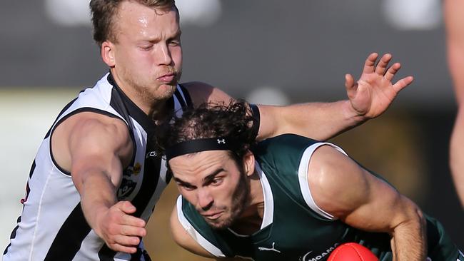 Euroa’s Harrison Jarvie prepares to tackle Echuca’s Mitch Kemp.