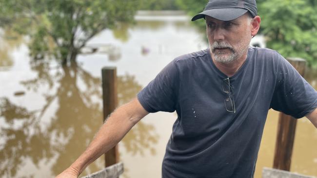 Adrian De'Athe's backyard looks like a river, and as he is ordered to evacuate on March 8, he hopes that the floodwaters do not enter his Camden home. Picture: Annie Lewis