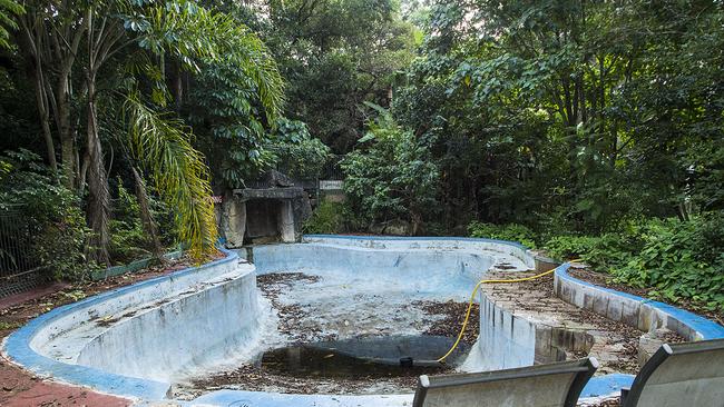 An empty, filthy pool paints a grim portrait of life here.