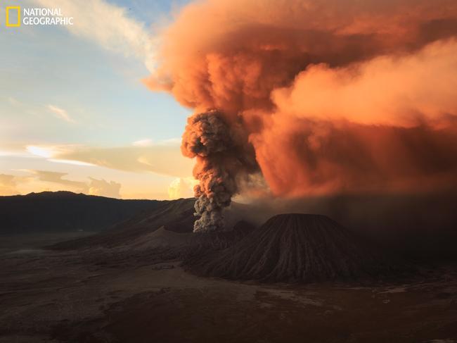 Early morning rays at Mt. Bromo ... A scene of sunrise rays which is reflected on an intense smoke of Bromo eruption. Picture: Rifky Setya/2016 National Geographic Nature Photographer of the Year