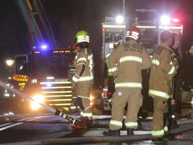 A group of shops and businesses have been destroyed by fire overnight. NSW Fire Brigade were called to Bankstown Railway Station after shops on a rail bridge overpass were well alight. A third alarm response was ordered to prevent the fire spreading. Rail lines were shut down briefly as a precaution. Pics Bill Hearne