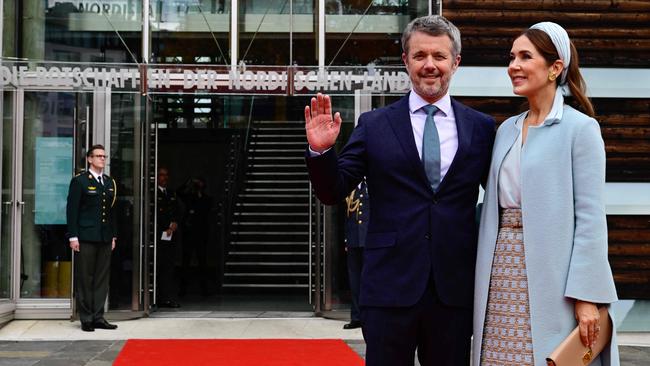 King Frederik and Queen Mary of Denmark pose upon arrival for a reception to celebrate the 25th anniversary of the Nordic embassy complex in Berlin. Picture: John MacDougall/AFP