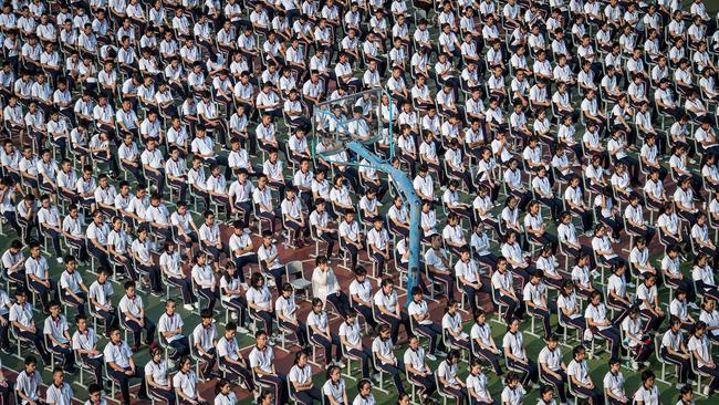 Students attend the 100th anniversary of the founding of Wuhan High School on the first day of the new semester in Wuhan.