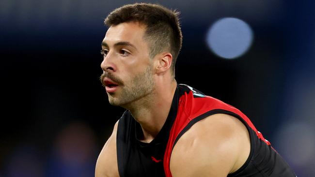 MELBOURNE, AUSTRALIA - MAY 01: Kyle Langford of the Bombers handballs during the round eight AFL match between Essendon Bombers and North Melbourne Kangaroos at Marvel Stadium, on May 01, 2025, in Melbourne, Australia. (Photo by Josh Chadwick/Getty Images)