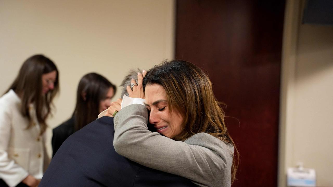 US actor Alec Baldwin and his wife Hilaria Baldwin embrace during his trial on involuntary manslaughter. Picture: Ramsay de Give / Pool / AFP