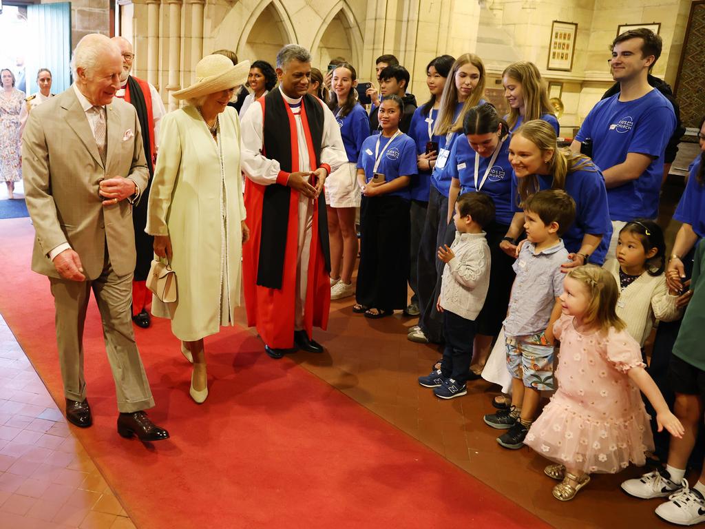 A little girl does a curtsy as their Majesties attend a church service officiated by the Archbishop of Sydney, the Most Reverend Kanishka Raffel. Picture: Rohan Kelly