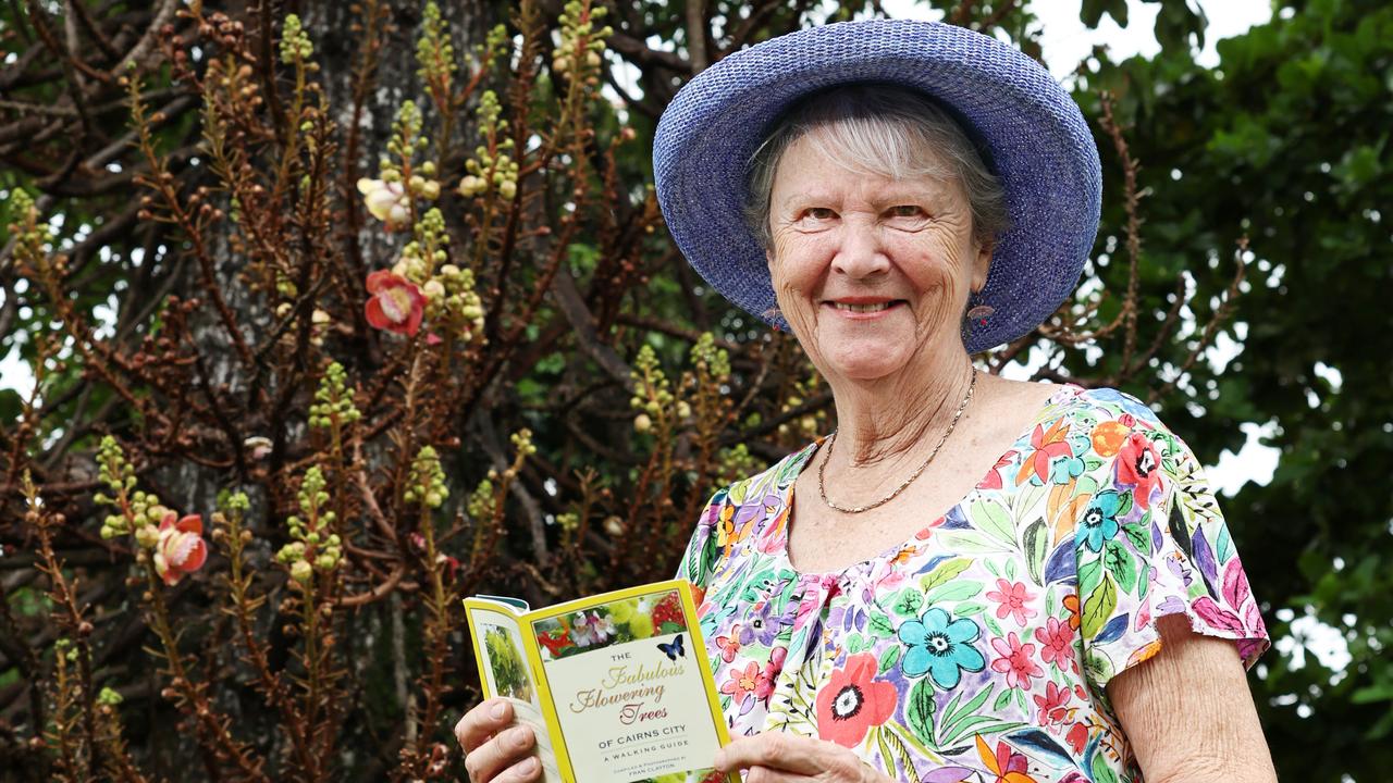 Cairns botany enthusiast Fran Clayton is marking 20 years since her book The Fabulous Flowering Trees of Cairns City: A Walking Guide was published, with Cairns Regional Council planting a tree on the Cairns Esplaande to mark the occassion. Fran Clayton admires a cannonball tree as it flowers and fruits on the Cairns Esplanade. Picture: Brendan Radke