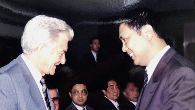 Bob Hawke with China Institute of Strategy and Management secretary-general Qin Chaoying in 1993, watched by Undercover Minister of State Security official Yu Enguang, centre with glasses, and publishing front chairman Qin Chuan.