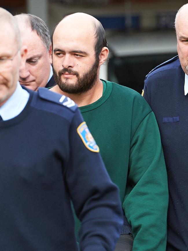 Marcus Stanford, the twin brother of murderer Vincent Stanford, who killed Leeton schoolteacher Stephanie Scott is led into Leeton Court for sentencing on being an accessory to the murder. Picture: Michael Frogley