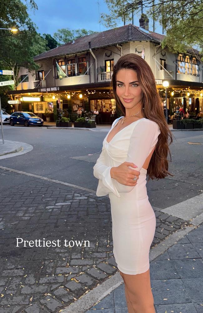 Posing on a street in Surry Hills near the CBD in a white long-sleeved mini dress, she described the area as the prettiest town and said it felt like home sweet home. Picture: Instagram/Jessica Kahawaty