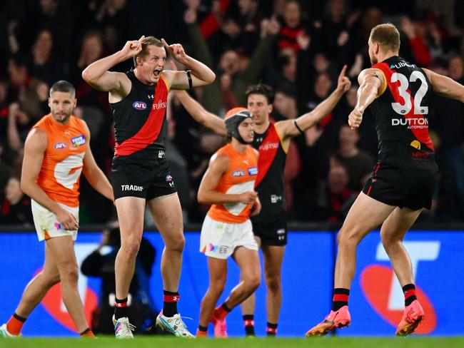 MELBOURNE, AUSTRALIA - MAY 11: Mason Redman of the Bombers celebrates a goal during the round nine AFL match between Essendon Bombers and Greater Western Sydney Giants at Marvel Stadium, on May 11, 2024, in Melbourne, Australia. (Photo by Morgan Hancock/AFL Photos/via Getty Images)