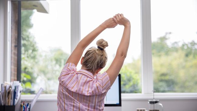 You can stretch your back and neck while sitting. Picture: iStock