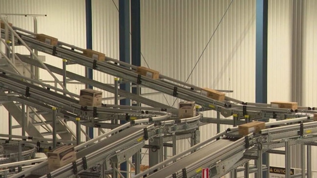 In the warehouse, packers are replaced by complex machines. Picture: Channel 9.