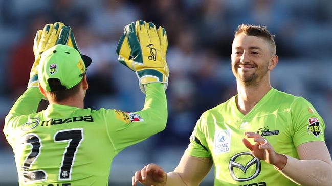 Daniel Sams celebrates after claiming the wicket of Sam Heazlett of the Heat.