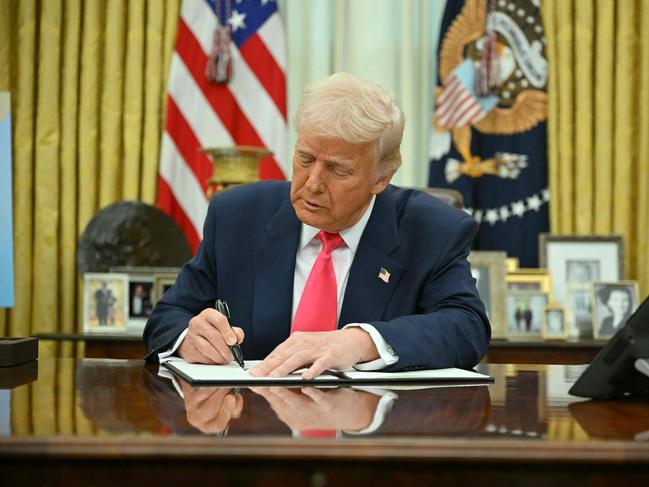 US President Donald Trump signs a Women's Month Proclamation in the Oval Office of the White House in Washington, DC on March 6, 2025. Picture: AFP