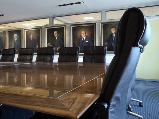 The boardroom at AFL House and its imposing photos of the code's venerated former chairmen and presidents.