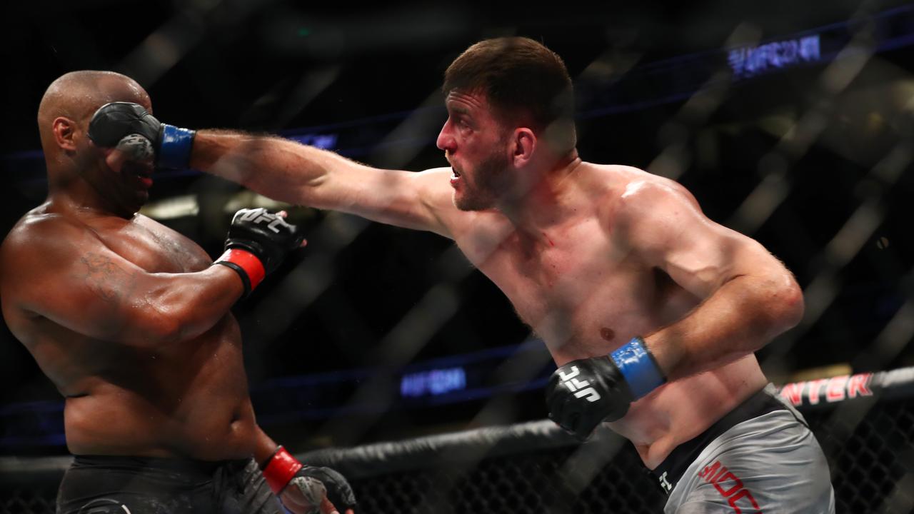 Stipe Miocic (R) and Daniel Cormier will make history in their third heavyweight clash on Sunday.