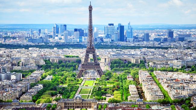 Paris with the Champ-de-Mars, Eiffel Tower and skyscrapers of La Defense.