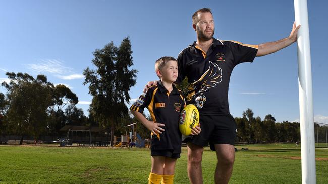 Angle Vale Football Club junior coordinator Troy Treverton with his son Logan, who plays in under-11s. Picture: Naomi Jellicoe