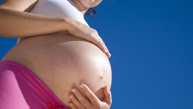 09/11/2010 NEWS: 09/11/2010 NEWS: Caucasian pregnant woman with hands on her belly against the blue sky. Pregnant belly . Stomach . Baby . babies . Generic .